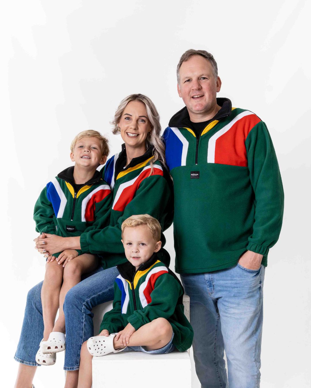 Family wearing the Polar fleece SA flag Jerseys in colour green