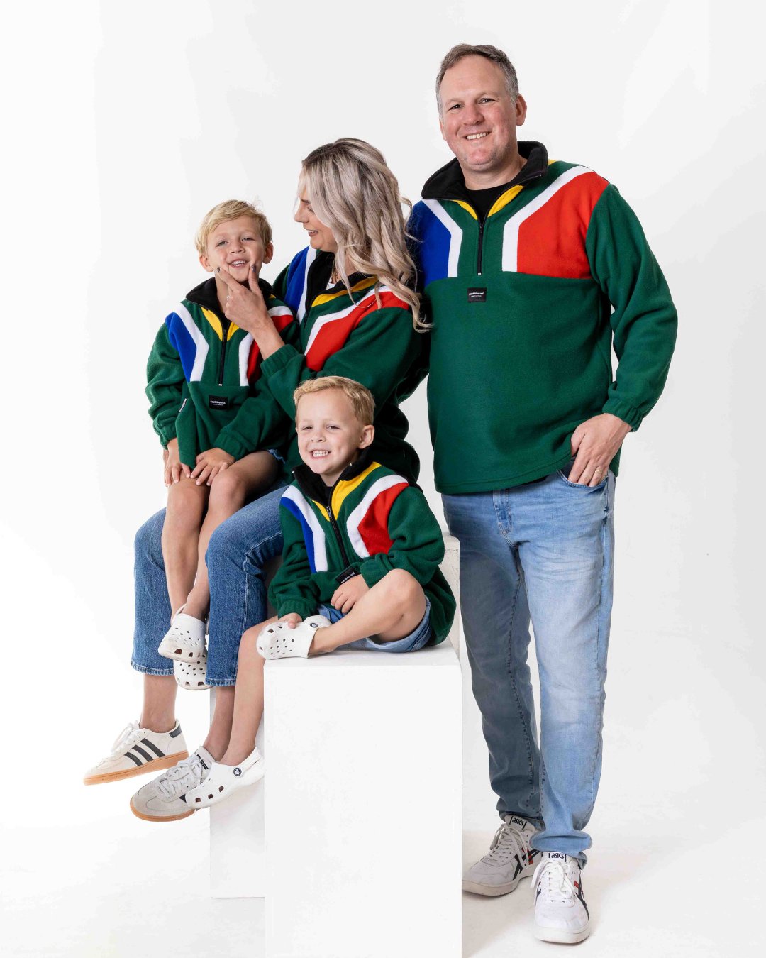 Family wearing the polar fleece SA flag jerseys in colour green