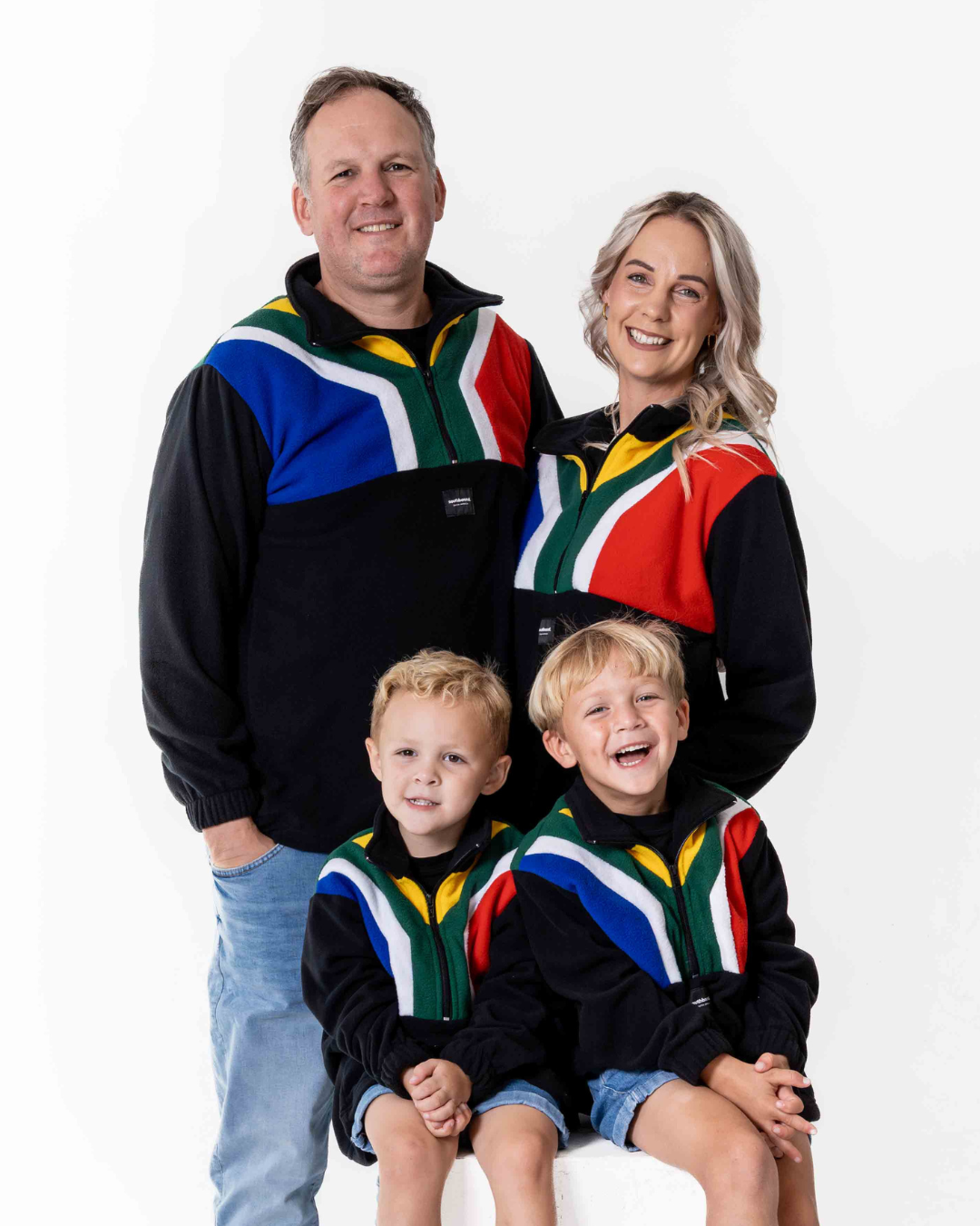 Family wearing the polar fleece SA flag jerseys