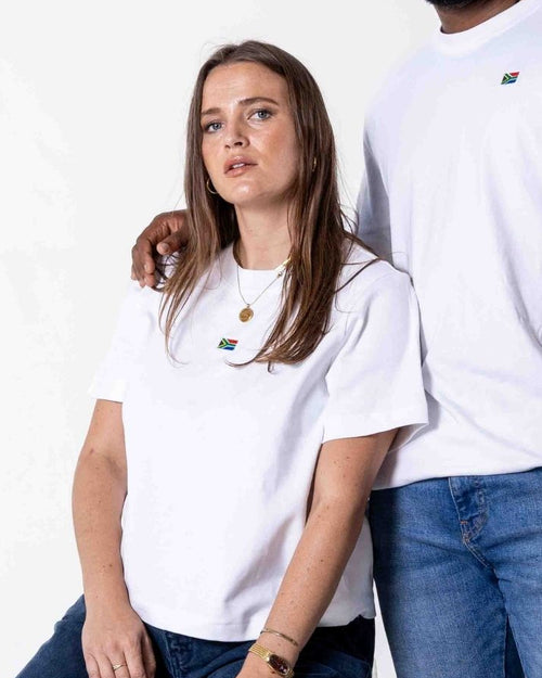 Female and male wearing a white Female SA T-shirt