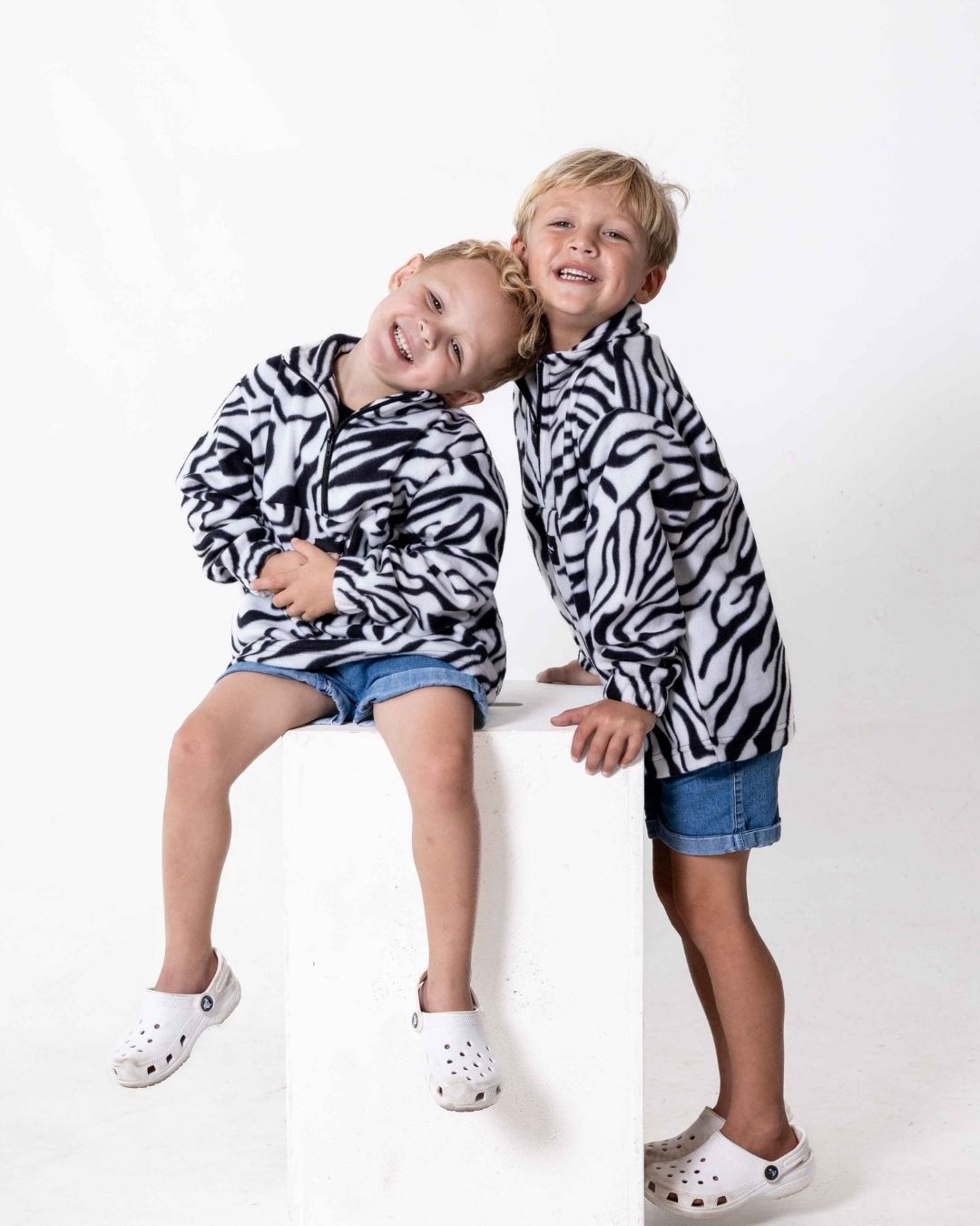 Children wearing the Kids Safari animal print jersey in zebra print