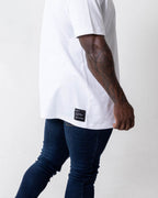 Male wearing the Oversized SA T- Shirt- back patch view