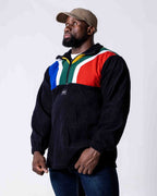 Man wearing a polar fleece SA flag jersey in colour black