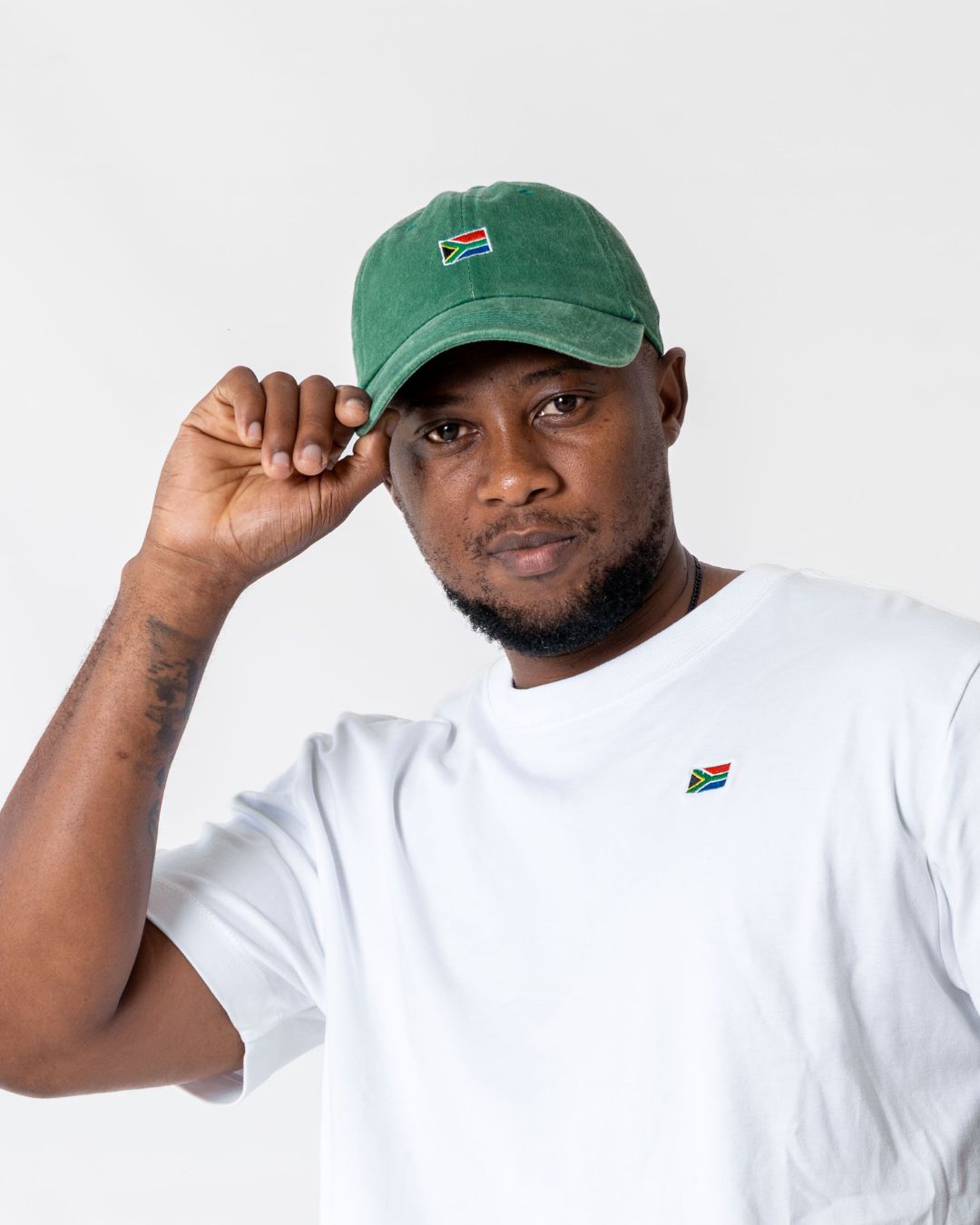 Male wearing the SA Flag cap green front view