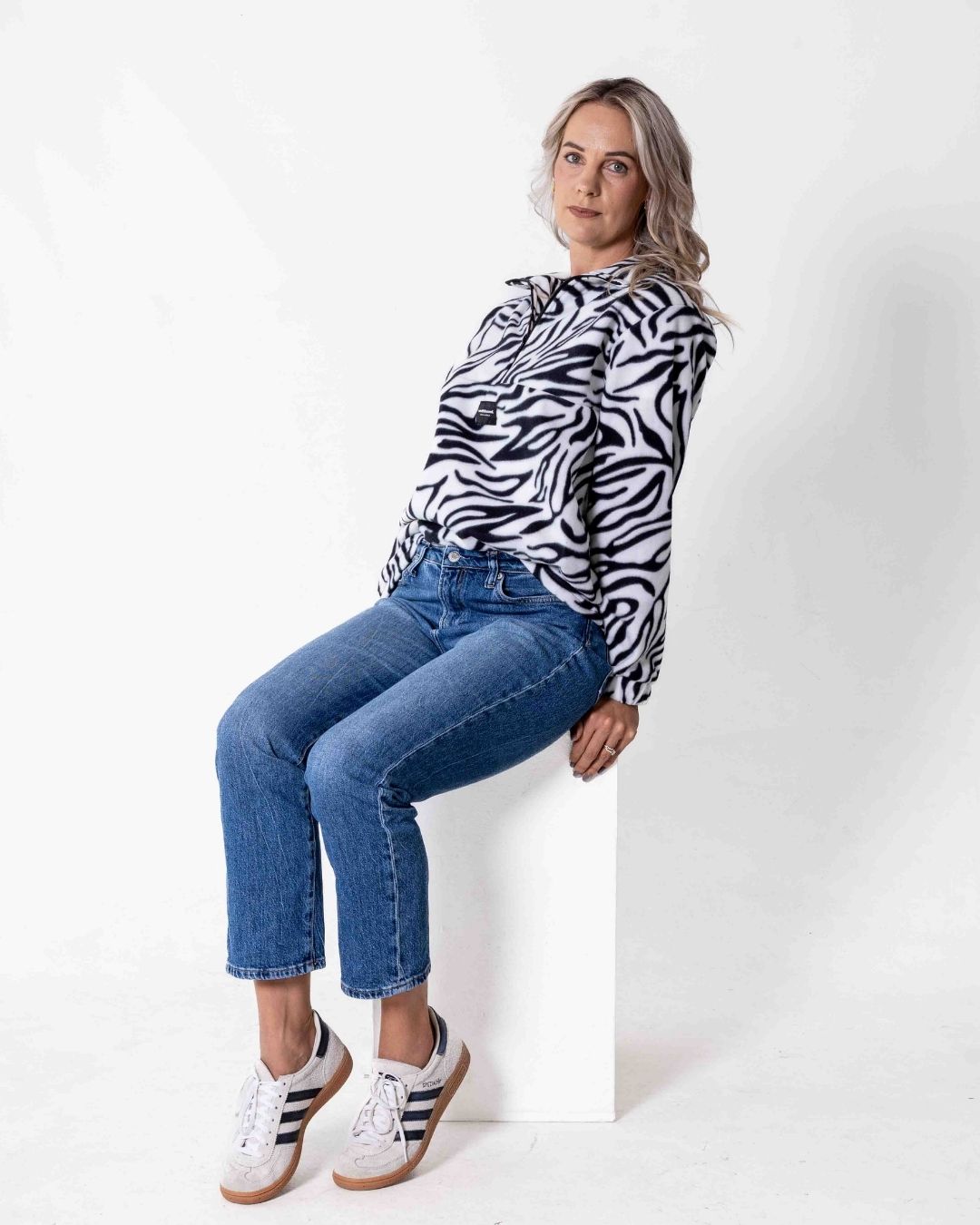 Female wearing a Safari animal print Jersey in front of a white backdrop