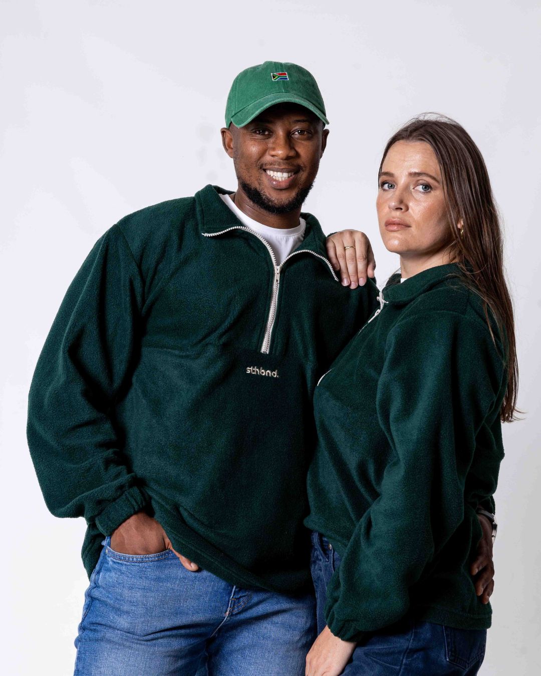 Male and female wearing the Southbound Fleece Quarter zip jersey in colour green
