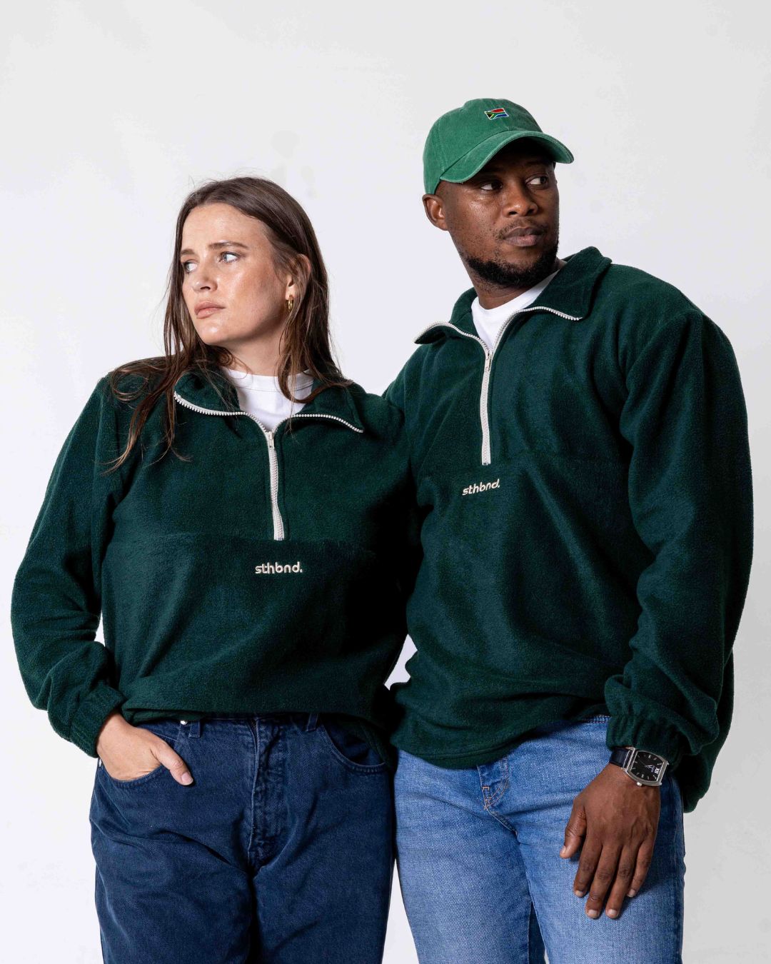 Male and female wearing the Southbound Fleece Quarter zip jersey in colour green