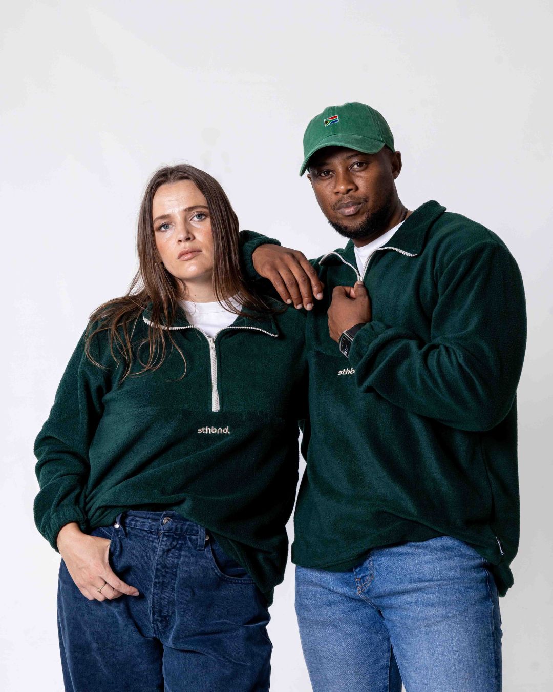 Male and female wearing the Southbound Fleece Quarter zip jersey in colour green 