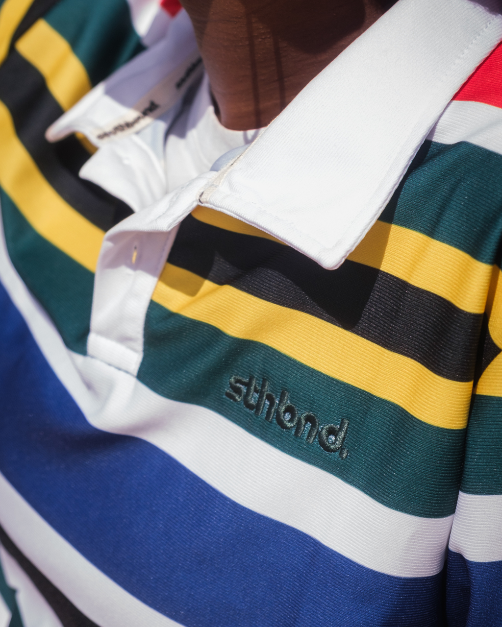 Female wearing a strip polo shrt