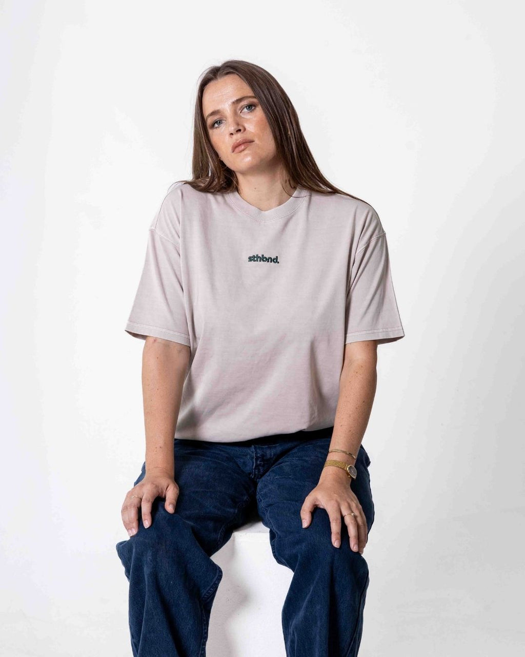 Female wearing a southbound staple oversized  T- Shirt