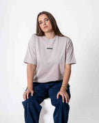 Female wearing a southbound staple oversized  T- Shirt