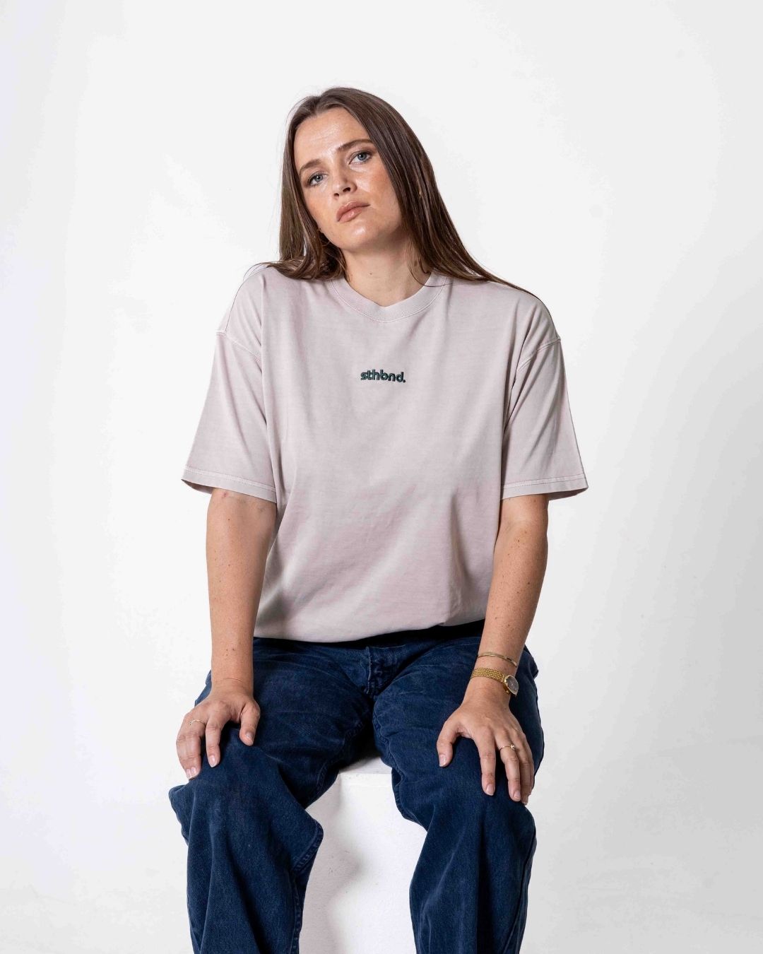 Female wearing a southbound staple oversized  T- Shirt